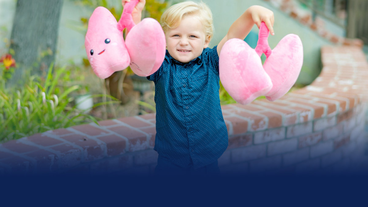 child holding plush lungs
