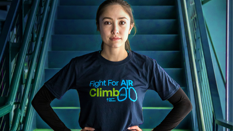 Fight For Air Climb participant standing in front of stairs