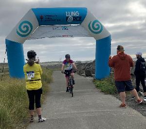 Crossing the finish line in 2021 after 107 miles