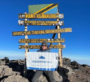 At the summit of Mt. Kilimanjaro in loving memory of Chris Reiner