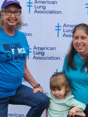 Mom, me, and baby Evie at the lung force walk in 2023